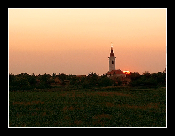 View from river to village in sunset
---------
 (  ,      )